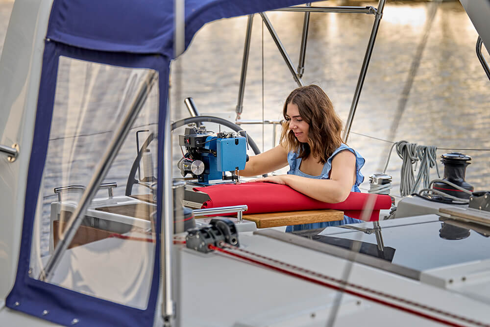 Sewing marine grade canvas on a boat
